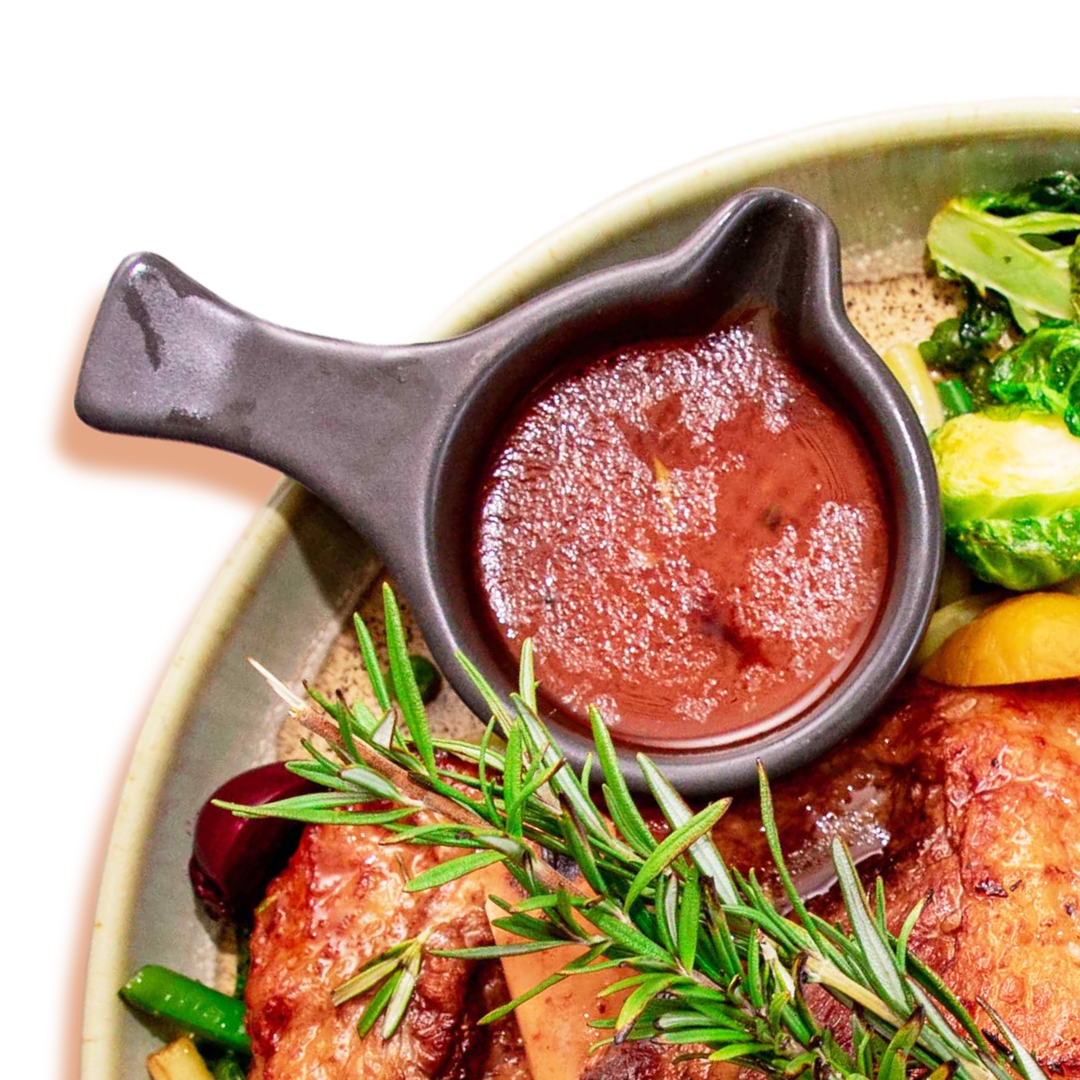 Grilled meat with rosemary and dipping sauce.
